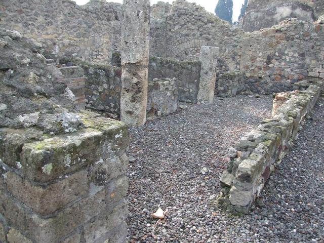 VI.5.3 Pompeii. December 2007. Looking west from the corridor of room 7 across the south side of atrium to doorway to room 20. According to Breton, on the left would have been the wall with the painting of Neptune. According to Helbig, the atrium also contained a painting – the chariot of Artemis (246) as well as one of Poseiden or Neptune. (172)
See Breton, Ernest. 1870. Pompeia, Guide de visite a Pompei, 3rd ed. Paris, Guerin. See Helbig, W., 1868. Wandgemälde der vom Vesuv verschütteten Städte Campaniens. Leipzig: Breitkopf und Härtel. (246, 172) Schefold showed a black-and-white photo of this wall in Taf.101 of the book below. See Schefold, K., 1962. Vergessenes Pompeji. Bern: Francke.(p.122 and Taf.101)