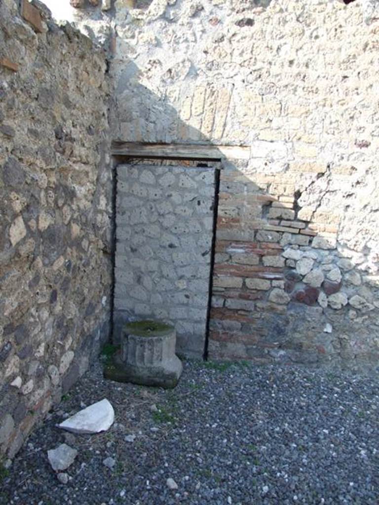 VI.7.1 Pompeii.  March 2009. Blocked door in north west corner of atrium area.