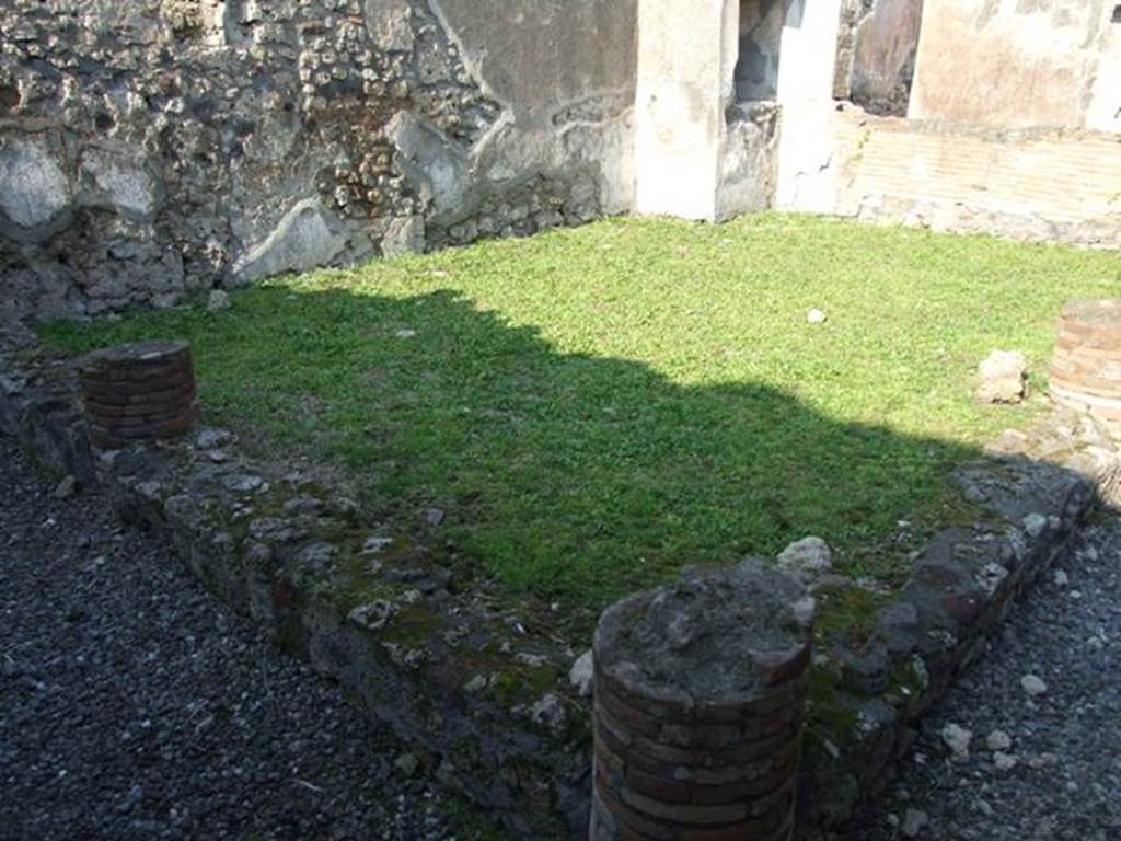 VI.7.6 Pompeii. March 2009. Area 6, garden area with remains of columns with a low wall.