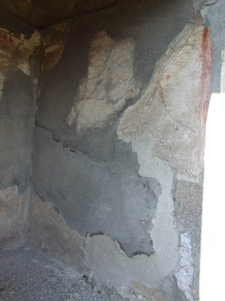 VI.7.6 Pompeii. March 2009. East wall of lararium, originally with paintings of garlands and a serpent..