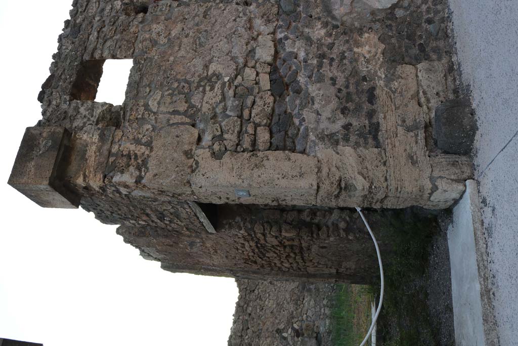 VI.7.9 Pompeii. March 2009. Exterior front façade on north side of entrance doorway.