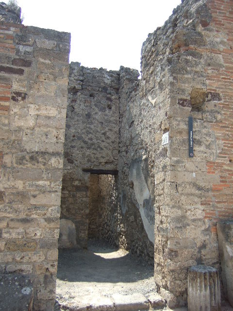 VI.8.14 Pompeii. May 2010. North-east corner near Via di Mercurio, looking east.