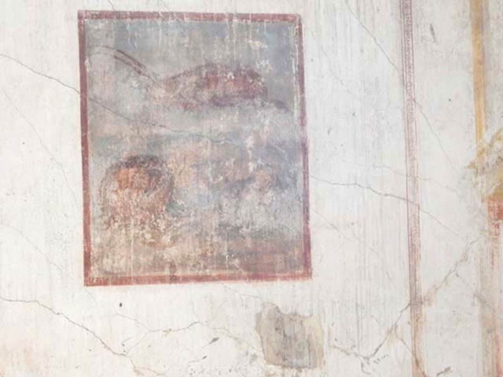 VI.8.24 Pompeii. May 2017. Detail of central painting from east wall of triclinium in south-east corner of atrium.
Photo courtesy of Buzz Ferebee.
The central painting was a still life which showed a fallen basket with a capsized fish on a podium, in the background was a lobster/crayfish.

