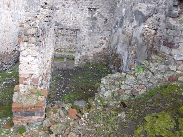 VI.10.4 Pompeii.  March 2009.  Looking along north wall of atrium area to two doors into rear of VI.10.3.