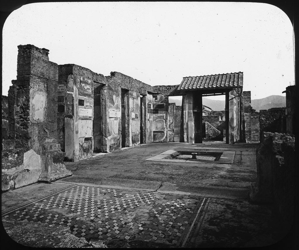 VI.12.2 Pompeii. Photo by George Washington Wilson. 
Looking from tablinum towards the east side of atrium, prior to 1943 bombing.
Used with the permission of the Institute of Archaeology, University of Oxford. File name instarchbx208im 128. Source ID. 44453.
See photo on University of Oxford HEIR database
