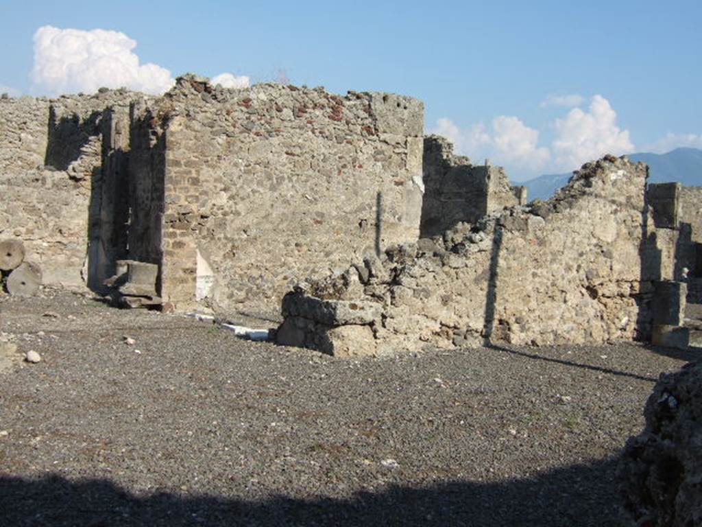 VI.13.2 Pompeii. September 2005.  Looking south-east towards rear of andron, the east wall of tablinum and oecus, on the right.


