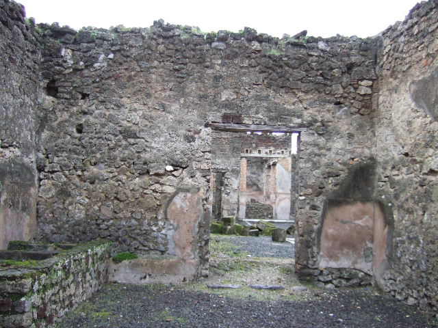 VI.14.21 Pompeii. December 2005. Looking west from entrance, towards vats in south-west corner.