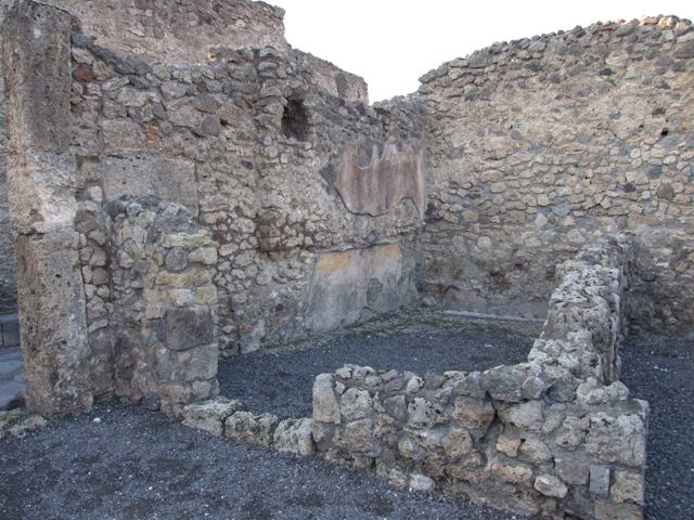 VI.14.44 Pompeii. December 2007. Base of steps to upper floor or bench or counter?