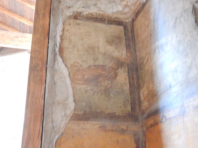 VI.15.1 Pompeii.  December 2006.  View into glass case on South side of Atrium.  This contained an iron and bronze strongbox or safe.  
This was being restored as at Dec 2006.   Painting on rear wall was dated by Mau to be pre 63 AD.  Maiuri did not agree.  See Mau, A., 1907, translated by Kelsey F. W. Pompeii: Its Life and Art. New York: Macmillan. (p.327).

