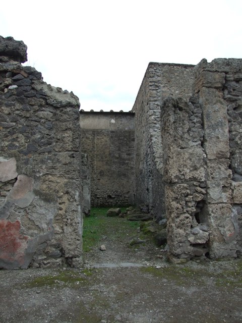 VI.16.5 Pompeii. May 2005. Looking west across shop towards rear room.