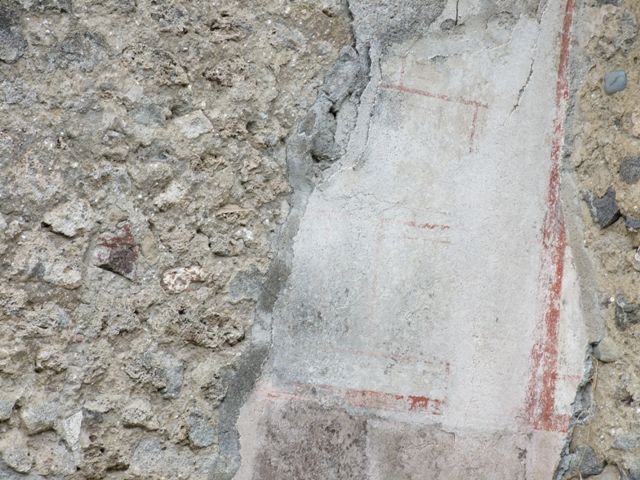 VI.16.13 Pompeii. Shop and workshop. December 2007. Painted plaster in north west corner of shop.