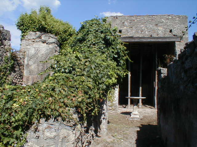 VI.16.28 Pompeii. March 2009. North-west corner of room 3, atrium, with doorway to room 2, room with stairs.