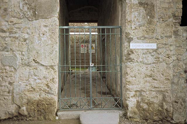 VII.1.47 Pompeii. December 2005. Entrance corridor mosaic of SALVE LVCRVM. (Hail, profit)  [CIL X 874] See Cooley, A. and M.G.L., 2004. Pompeii : A Sourcebook. London : Routledge. (p.168)

