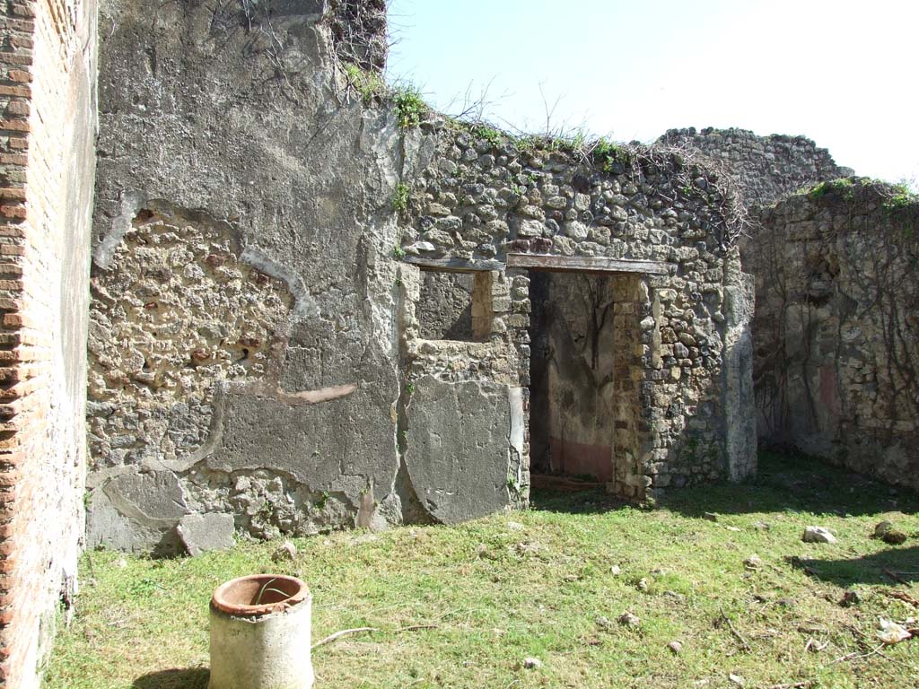 VII.3.30 Pompeii. March 2009. Room 1, north-east corner of atrium, and doorway to room 7.