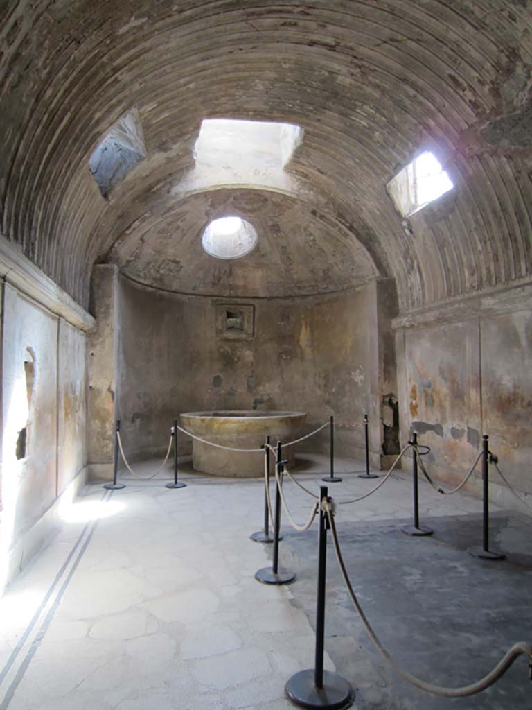 VII.5.24 Pompeii. March 2012. 
Caldarium (39), looking south towards large marble basin or labrum (41). Photo courtesy of Marina Fuxa.
