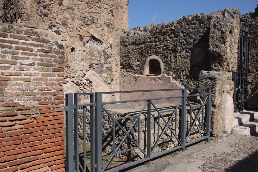 VII.7.11 Pompeii. October 2023. Entrance doorway to workshop with counter. Photo courtesy of Klaus Heese.