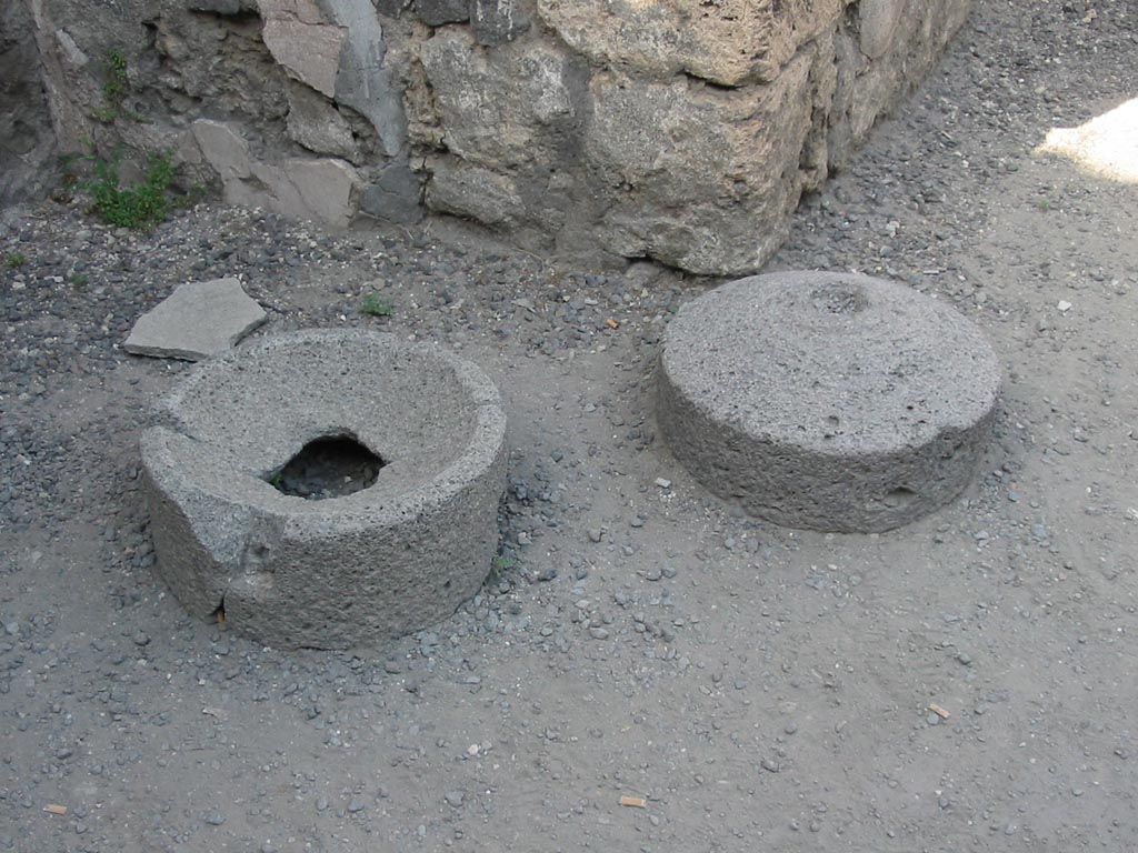 VII.7.11 Pompeii. May 2003. Mill stones. Photo courtesy of Nicolas Monteix.