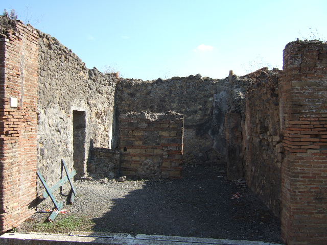 VII.9.29 Pompeii. March 2009. Looking through gap in south wall into rear room.