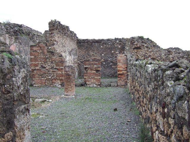 VII.9.38 Pompeii. December 2005. Looking towards doorway to triclinium, in north-west corner of atrium.  According to Helbig, a painting of Danae was found in the triclinium.
See Helbig, W., 1868. Wandgemälde der vom Vesuv verschütteten Städte Campaniens. Leipzig: Breitkopf und Härtel. (120)
