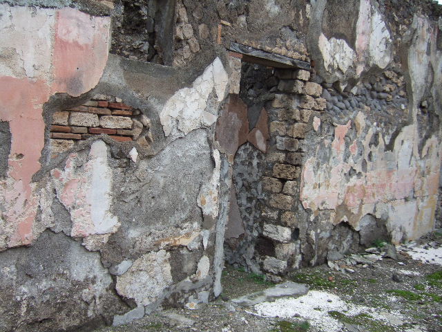 VII.10.3 Pompeii. December 2005. Room 12. Mosaic floor and marble door supports in door threshold.