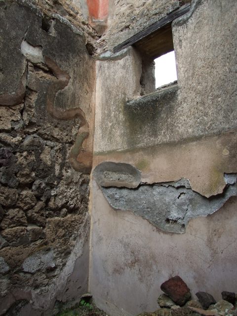 VII.10.9 Pompeii. March 2009. Small room or storeroom on west side of corridor. West wall.