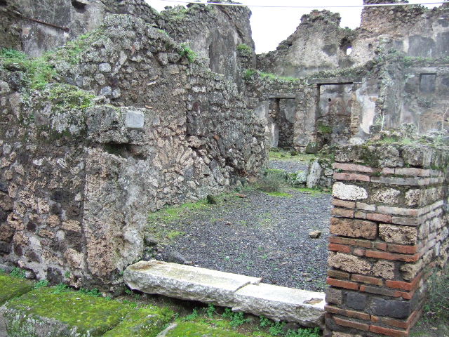 VII.10.12 Pompeii. December 2007. Doorway in west wall at rear, leading to corridor linking VII.10.12 to VII.10.9.