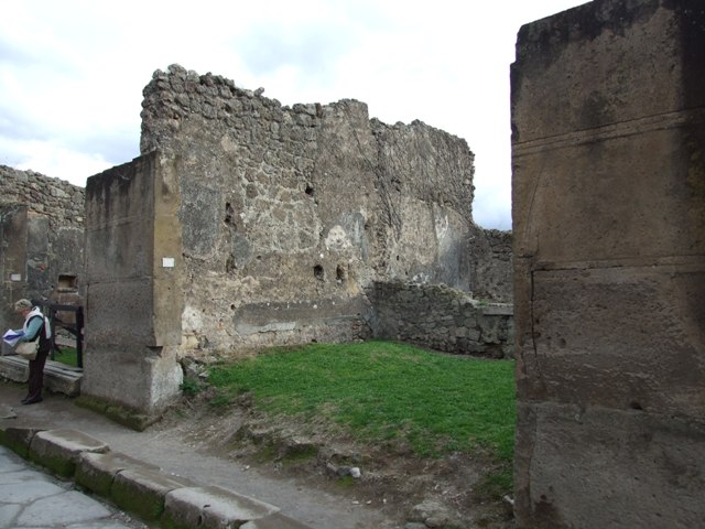 VII.12.13 Pompeii. December 2007. Looking south to rear room on left, and corridor to bakery area on right.