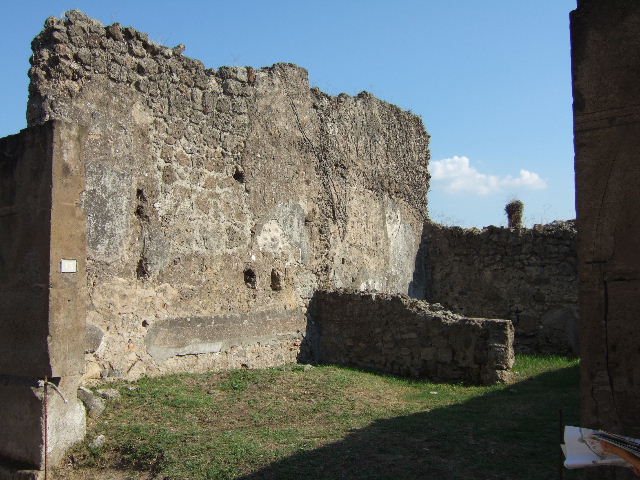 VII.12.13 Pompeii. September 2005. Looking south to rear room on left, and corridor to bakery area on right.
