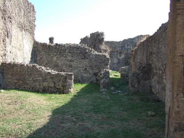 VII.12.13 Pompeii. September 2005. Niches over hearth on east wall.