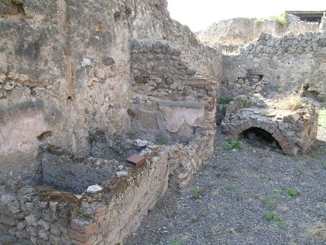 VII.12.23  Pompeii.  Casa del Camillo.  December 2007.   Room on north side of atrium.  North wall.