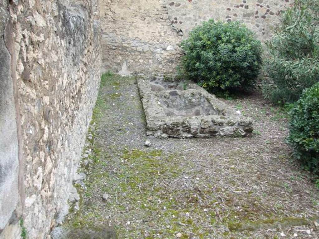 VII.14.5 Pompeii. March 2009. Room 11, two basins at west end of peristyle garden area.  According to Jashemski, two basins at the west end of the garden collected rain water from the neighbouring roofs. This was for use in the dye-house installed in the area adjacent to the garden on the west. The garden, which may have been used for drying the dyed fabric, had a hunt scene which was badly damaged at the time of excavation.
See Jashemski, W. F., 1993. The Gardens of Pompeii, Volume II: Appendices. New York: Caratzas. (p.198)
