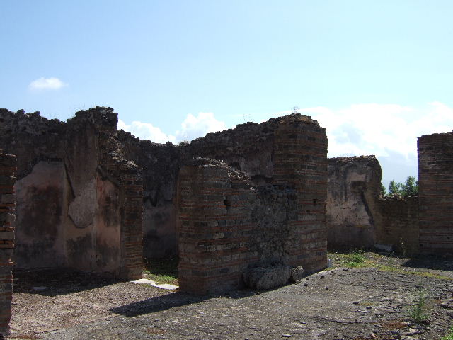VIII.2.30 Pompeii. September 2005. Looking west across south side of atrium, from east ala to west ala.