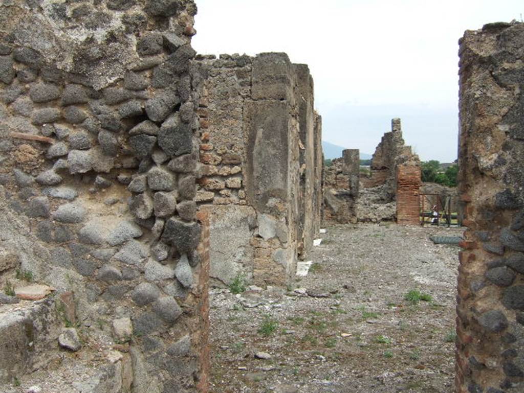 VIII.2.34 Pompeii. May 2006. Looking north from room with stairs, along west side of atrium. 