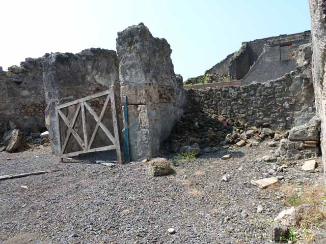 VIII.3.18 Pompeii. May 2010. Looking south to doorway to triclinium in south-west corner of atrium.Taken from VIII.3.19. 