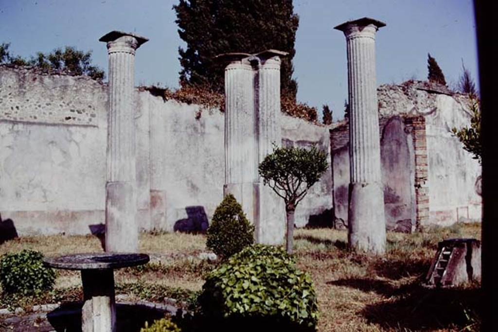 VIII.4.4 Pompeii, 1978. Looking south-east across garden, without the statuette on its base. Photo by Stanley A. Jashemski.   
Source: The Wilhelmina and Stanley A. Jashemski archive in the University of Maryland Library, Special Collections (See collection page) and made available under the Creative Commons Attribution-Non Commercial License v.4. See Licence and use details. J78f0233
