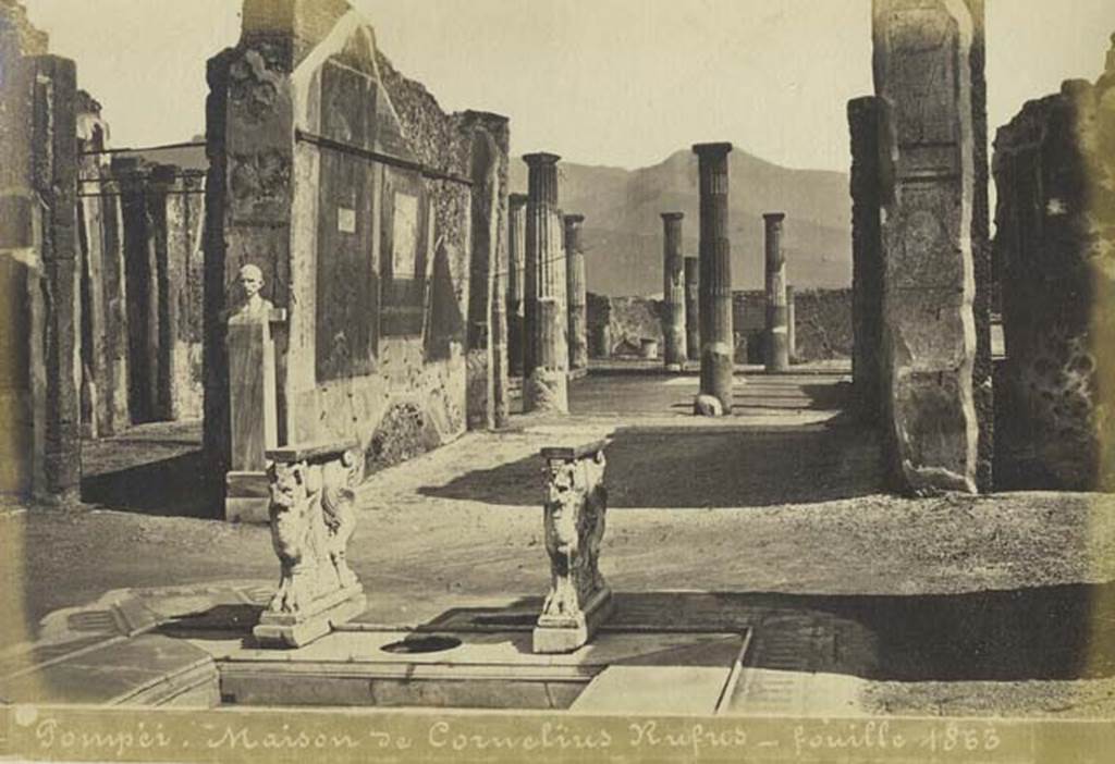 VIII.4.15 Pompeii. Undated photograph by Mauri, numbered 014. Looking south across impluvium towards decorated east wall of tablinum.  Photo courtesy of Rick Bauer.
