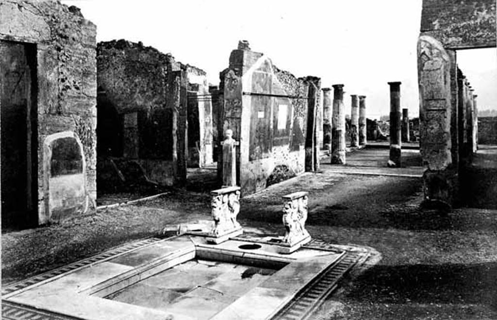 VIII.4.15 Pompeii. Photo taken c.1870. Looking south from atrium towards tablinum. Note the beautiful marble surround to the impluvium.  Photo courtesy of Rick Bauer.
