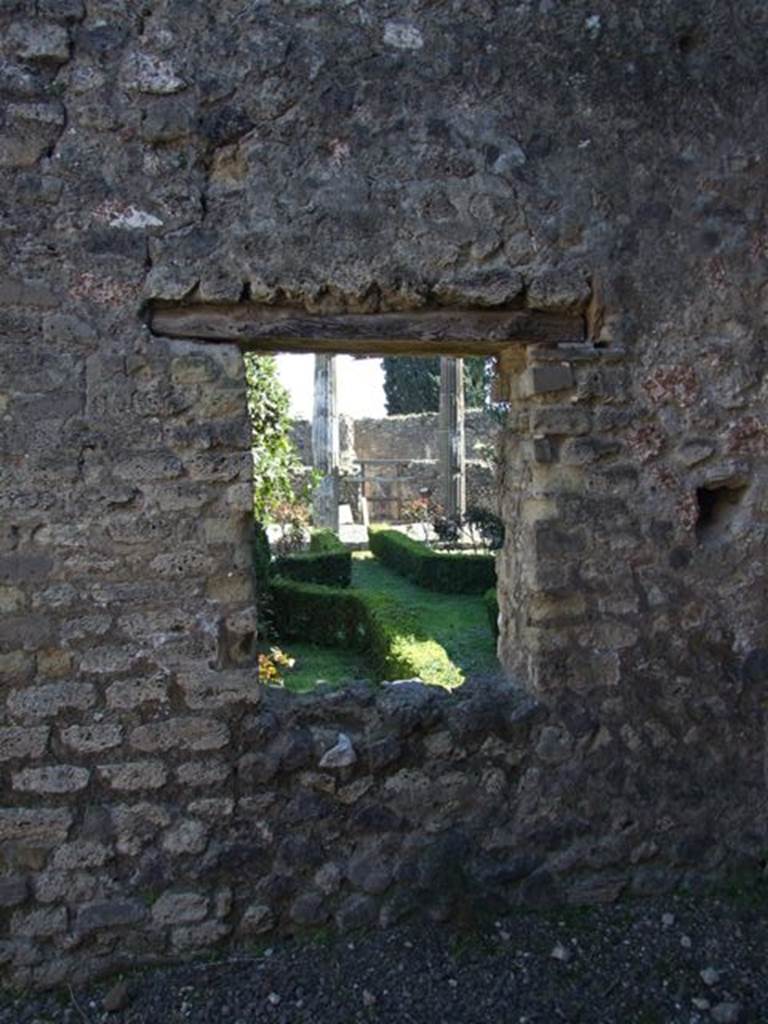 VIII.5.28 Pompeii.  March 2009. Room 12, Oecus.  East wall, with window overlooking Garden area.