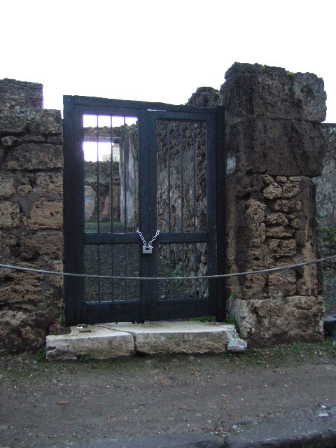 IX.1.7 Pompeii. December 2007. Remains of stone stairs on north wall of corridor.