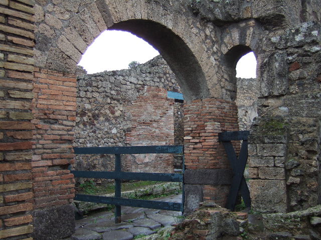 IX.2.28 Pompeii. December 2005. Downpipe in north wall of latrine.