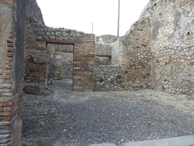 IX.3.13 Pompeii.  March 2009.  Triclinium.  West wall, with remains of plaster.