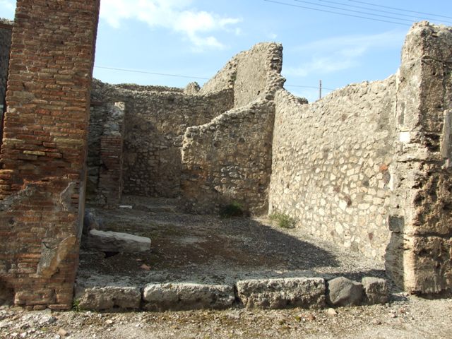 IX.3.16 Pompeii.  March 2009.  Looking north from workshop to steps to upper floor and rear room.