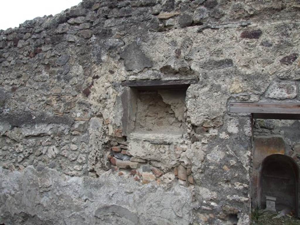 IX.3.20 Pompeii. December 2007. Room 6, niche on west wall of an open courtyard. This courtyard, as well as the open courtyard in room 7, would have been used for cleaning the grain.

