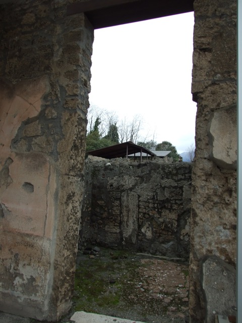IX.8.6 Pompeii. September 2004. Doorways to Rooms 7 and 6 on west side of atrium.