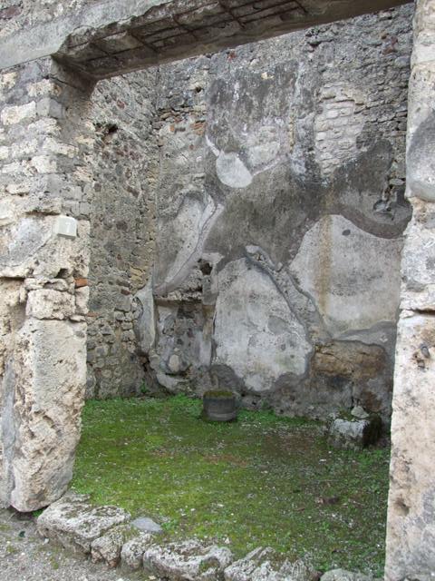 IX.8.7 Pompeii. March 2009. Remains of base of stairs to upper floor, against south wall.