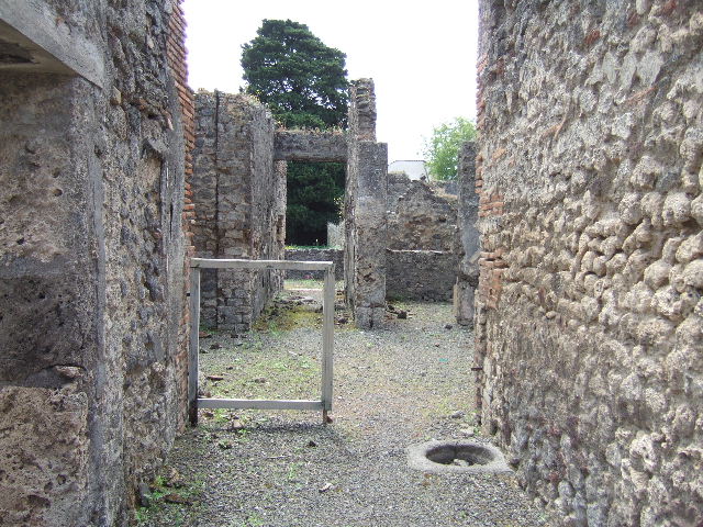 IX.9.6 Pompeii. May 2006. East side of atrium, with base of stairs to upper floor.