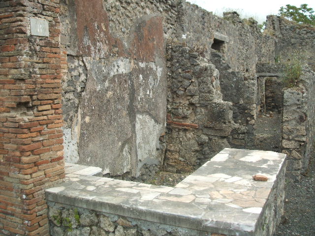 IX.9.8 Pompeii. May 2010. West wall of bar, with rear room. Looking south.