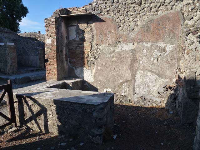 IX.9.8 Pompeii. May 2010. Looking south to rear of bar, with corridor leading to IX.9.9.
