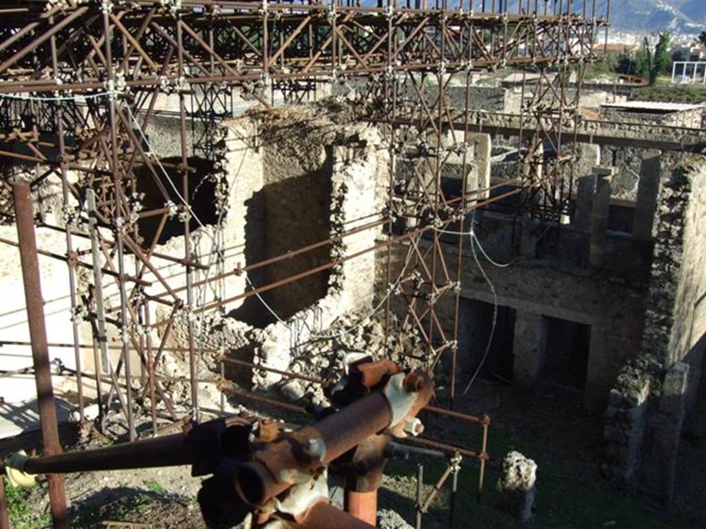 IX.12.6, IX.12.5, IX.12.4 and IX.12.3 Pompeii. March 2009. Showing rear view.