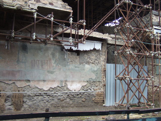IX.12.7 Pompeii. May 2010. The street entrance to IX.12.7 is on the left hand side.   Looking south from above room 8 in IX.12.6.

